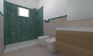 a bathroom with a toilet and a shower with green tiles at Casa Franco in Lampedusa