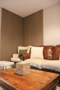a living room with a couch and a table at Britannia Lodge in Howden