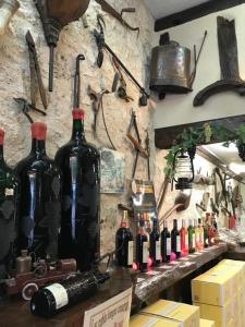 a bunch of bottles of wine on a wall at Poitevins in Saint-Astier