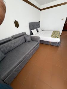 a living room with a couch and a bed at Private one-unit in Domina coral bay Beach and lake direct view 3 in Sharm El Sheikh