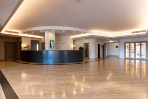 a lobby with a reception desk in a building at Aldero Hotel in Civita Castellana +28 photos