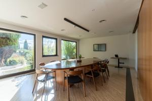 a dining room with a large table and chairs at Aldero Hotel in Civita Castellana