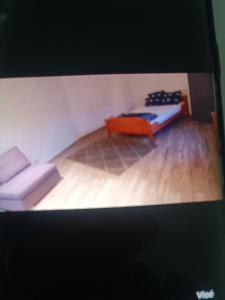 a room with a bed and a couch in it at Nke Roméo in Liège