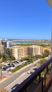 a view from a balcony of a parking lot at Rocha Paradise Apartment in Portimão