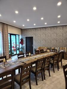 a large table and chairs in a room at Gabala Semerana Hotel Cottage in Gabala
