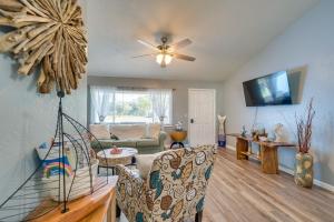 a living room with a couch and a ceiling fan at Beautiful Vacation Spot! in Beverly Hills