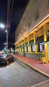 a car parked in front of a building at night at New Araucano in Mar de Ajó