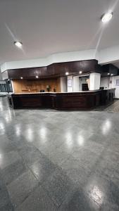 an empty room with a large room with a floor at New Araucano in Mar de Ajó
