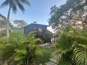 a tree house in the middle of a forest at Chalet Palo DAgua in Turbaco