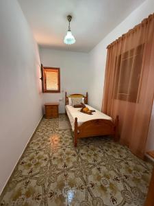 a small bedroom with a bed and a window at Nature in Tejeda in Tejeda