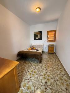 a bedroom with a bed and a rug at Nature in Tejeda in Tejeda