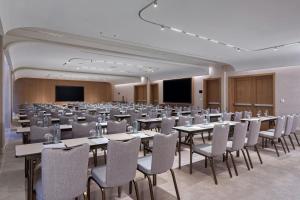 a large room with tables and chairs in it at The Landmark Nicosia, Autograph Collection in Nicosia +104 photos