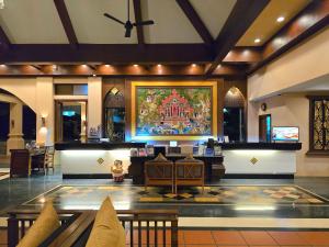 a lobby with a large painting on the wall at Avalon Beach Resort Pattaya in Pattaya South
