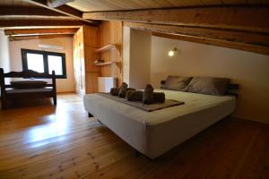 a bedroom with a large bed in a room at Lefkada Sunset Villa in Kalamitsi +46 photos