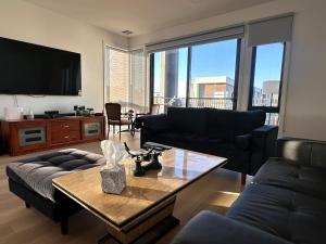 a living room with a couch and a table at The elite Home in Rockbank