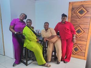 a group of three women posing for a picture at Mamela BNB in Elandsfontein