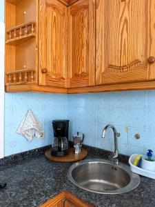 a kitchen counter with a sink and a coffee maker at Nature in Tejeda 2 in Tejeda +22 photos
