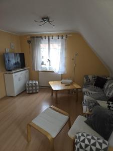 a living room with a couch and a table at Sebol in Immendingen