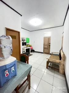 a room with a table with a bowl on top of it at Tiga Dara Homestay 3 in Pangandaran