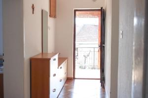 a room with a dresser and a door leading to a doorway at House Stoevi in Negotino