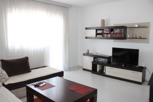 a living room with a couch and a coffee table at House Stoevi in Negotino