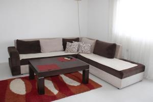 a living room with a couch and a coffee table at House Stoevi in Negotino