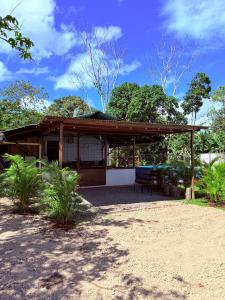 a house with a pavilion in a yard at Cabaña Gerya in Chachagua