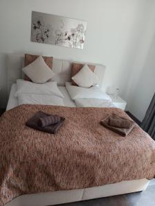 a bedroom with a bed with two pillows on it at Kontinental A in Bad Harzburg