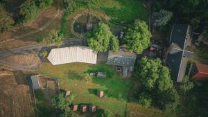 an aerial view of a farm field with a barn at Haus am Stausee in Altenbeuthen +8 photos