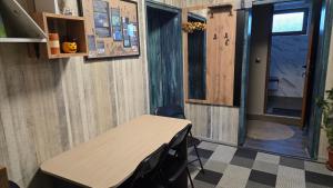 a room with a table and a window and a door at Nayri HOUSE Самоков,село Доспей in Dospey
