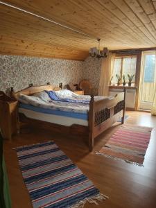 a bedroom with a large bed in a room at Helt hus i lilla Vuotner in Arvidsjaur