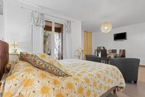 a bedroom with a bed with pillows on it at Le Mas du Soleil in Sainte-Maxime