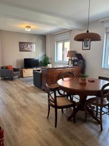 a living room with a table and a couch at Bel apartment - Waterloo in Waterloo