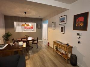 a living room with a table and a dining room at Bel apartment - Waterloo in Waterloo +10 photos