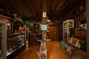a room with a bar with a table in it at Pousada Bob Pai & Bob Filho in Ilha do Mel