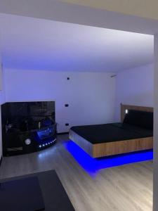 a bedroom with a bed and a fire place at Sanu Home B&B in Lonate Pozzolo