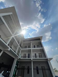 a building with the sun in the middle of it at AlinApartment in Ban Sa Kruat