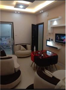 a living room with a couch and a table at الغردقة - اول ممشى شيرى in Hurghada