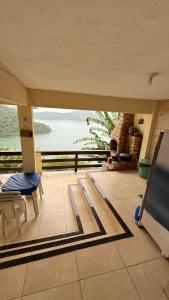 a living room with a view of a lake at Casa de praia da Michelly in Mangaratiba