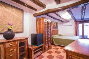 TV in/ali zabaviščno središče v nastanitvi B&B Casa Forcada