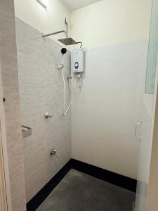 a shower in a bathroom with a shower at Misty Hues in Kandy