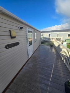 a building with a door and a patio at Towyn Winkups F07 in Rowen