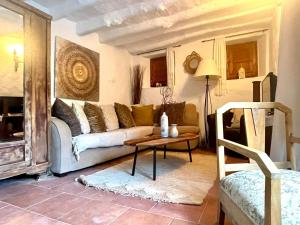 a living room with a couch and a table at Las Parras in Rute