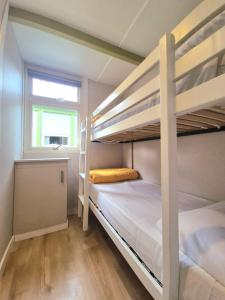 a bedroom with two bunk beds and a window at Camping El Jardín in El Campello +76 photos