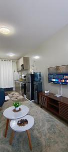 a large living room with a kitchen and a table at BlueByMis Studio Apartment in Muchatha