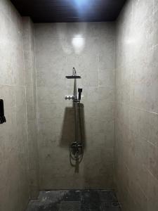 a shower stall in a bathroom with a wall at Batan Bingin House in Ubud +25 photos