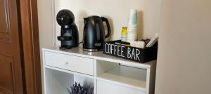 a shelf with a coffee bar on top of it at Affittacamere San Nicola in Montella