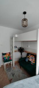 a room with two bunk beds and a table at Alojamiento céntrico Ribeira con parking sin ascensor in Ribeira +6 photos