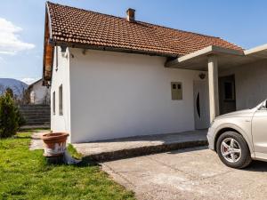 a white house with a fire hydrant in front of it at Villa Mia in Sarajevo +8 photos