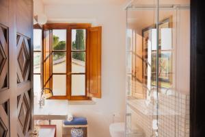 a bathroom with a toilet and a window at I Casciani in Montespertoli +73 photos